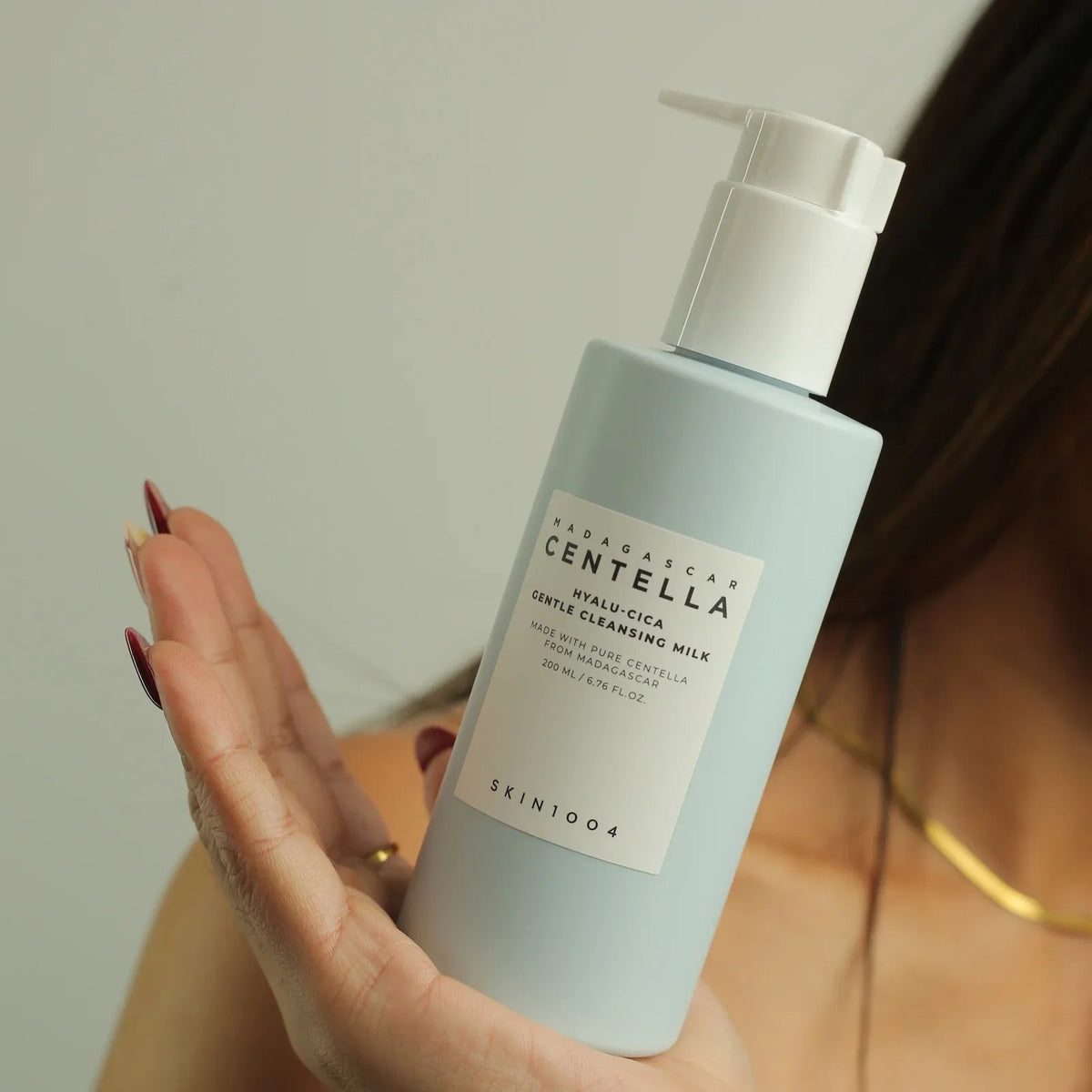 Madagascar Centella Hyalu-Cica Gentle Cleansing Milk by SKIN1004, held in hand for skincare routine