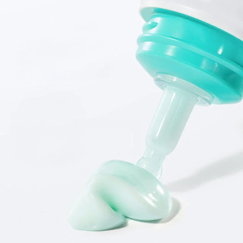 Mint green Korean beauty cream dispensing from tube, ideal for radiant skin care routines