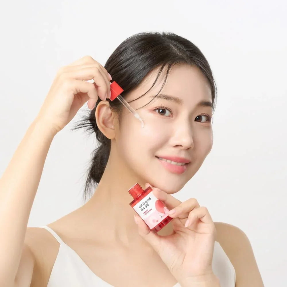 Korean beauty serum application, glowing skin routine with dropper bottle