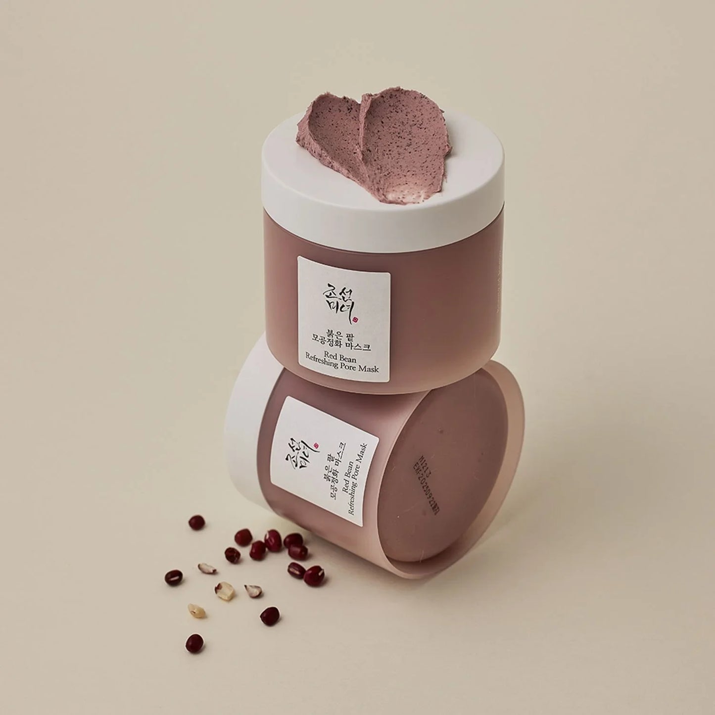 Red Bean Refreshing Pore Mask with heart-shaped cream and scattered beans, Korean beauty skincare