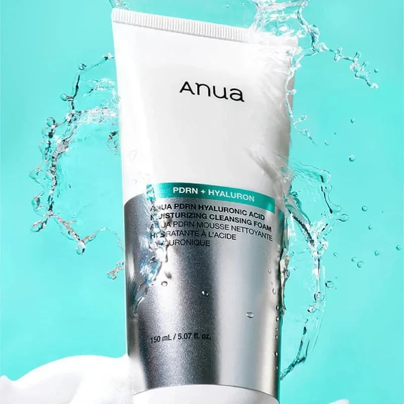Anua PDRN Hyaluronic Acid Moisturizing Cleansing Foam with water splash on teal background